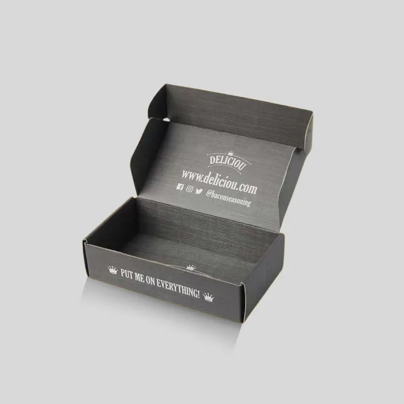 Black corrugated cardboard box with fitted interior inserts for premium retail presentation and unboxing