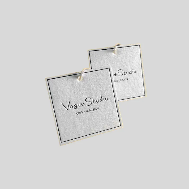 Close view of custom hang tags used to evaluate raised and recessed finish details