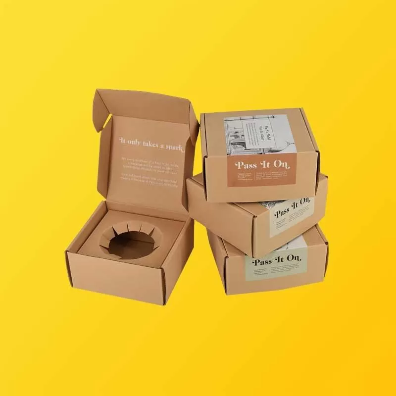 Custom kraft mailer box with branded printing showing color on natural board
