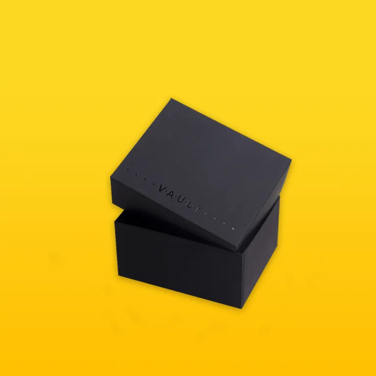 Open view of custom two-piece rigid box showing lid, base tray, and interior edge construction